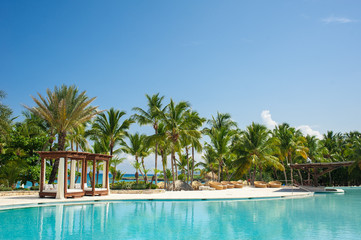 Fototapeta na wymiar Outdoor Swimming pool of luxury hotel resort near the sea