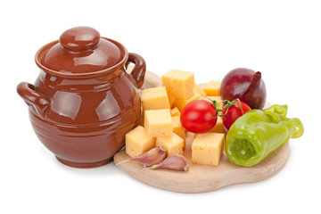 clay pot ,cheese and vegetables on wooden board © kuzina1964