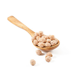 Uncooked chickpeas in wooden spoon on white background
