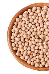 Uncooked chickpeas in wooden bowl on white background