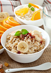 Healthy breakfast - oatmeal, cottage cheese, milk and fruit