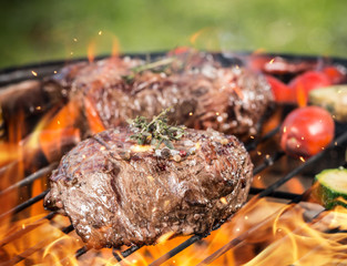 Beef steaks on grill