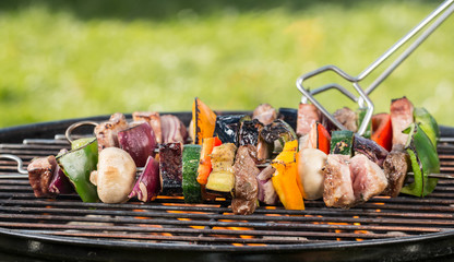 Delicious vegetable and meat skewer on grill