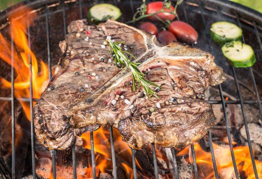 T-bone beef steaks on grill