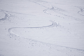 Fototapeta na wymiar Tracks on a mountain Slope, freeride in deep snow