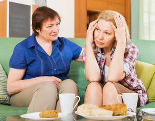 Two female sharing bad news