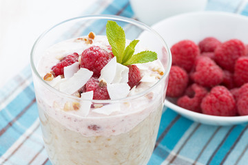 healthy dessert with oatmeal, whipped cream and raspberries