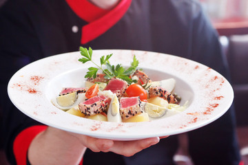 tasty salad in the hands