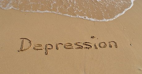 Text 'Depression' in the sand
