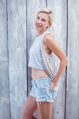 Fototapeta premium Pretty blonde woman smiling at the camera
