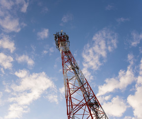 Telecom tower in the evening bright sunlight