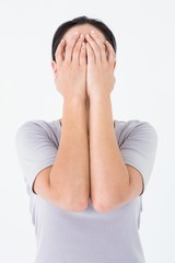 Sad woman hiding her face