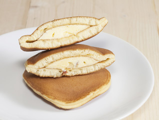 Dorayaki, Japanese Sweet  Pancakes on Wooden Table