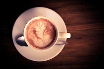 Hipster Cup of coffee  brown vintage on wood table