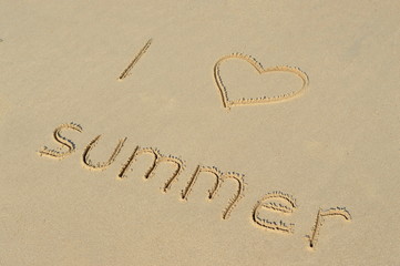 Text 'I love summer' in the sand