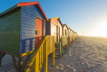 Fotobehang Sunrise at the famous colorful beach huts at Muizenberg Beach © Allen.G