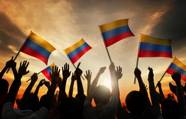 Fototapeten Silhouettes People Holding Flag Colombia Concept © Rawpixel.com
