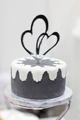 Wedding cake in white and grey with candy hearts
