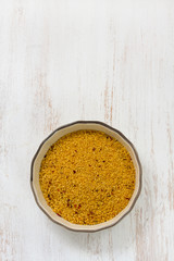 couscous in dish on white background