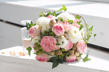 Wedding bouquet and bottle of perfume