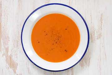 tomato soup in white plate on white background