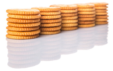 Round salted cracker over white background