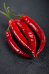 Burning hot vibrant red mexican chilli peppers