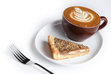 Cup of cappuccino and a piece of cake. Latte art. Isolated on wh
