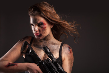 Riot girl with sniper gun close up portrait. 