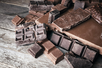 Set of chocolate on wooden table, closeup