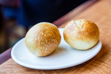 Two Fresh Baked Rolls on White Plate