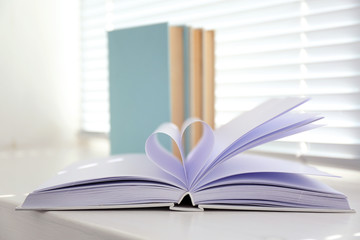 Books on white windowsill, close up