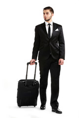 Elegant man in suit with suitcase isolated on white