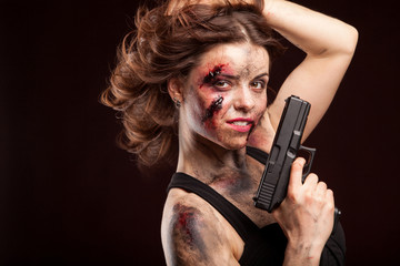 Woman warrior posing with knife. Ready to fight. With dirty face