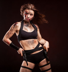 Woman warrior posing with knife. Ready to fight. With dirty face