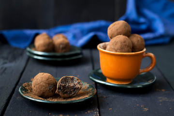 Candy with dates, chocolate and coconut on a dark background