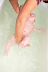 3 month baby swimming in the bath