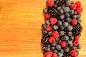 Summer berries on a wooden surface