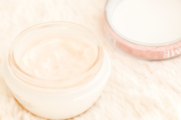 Cosmetic cream in jar close up shallow DOF