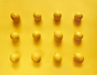 Lemons on yellow background