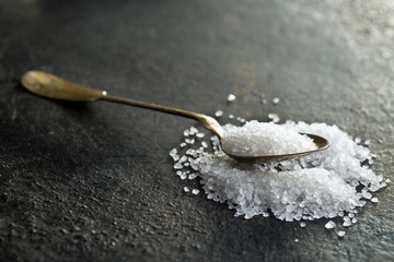 silver spoon with white salt
