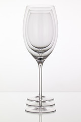 Empty wineglass on a glass table