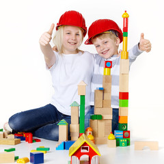 Kids are building with bricks
