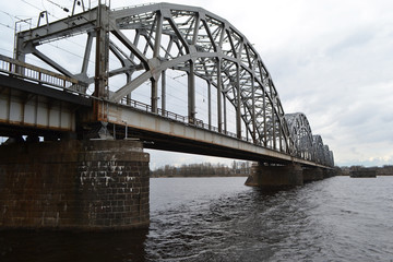 Fototapeta na wymiar Railway bridge across the Daugava river.