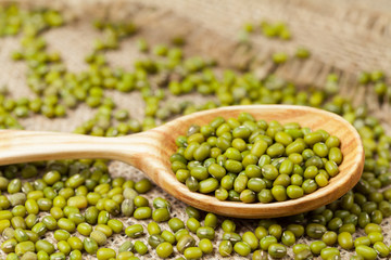 Heap of natural raw mung beans healthy clean foods in spoon