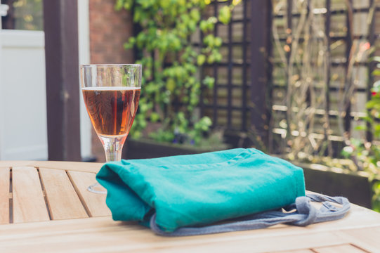 Glass of beer and apron on table