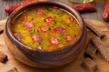 Traditional beer soup with sausage croutons and beer on vintage