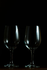 Empty wine glasses on black background