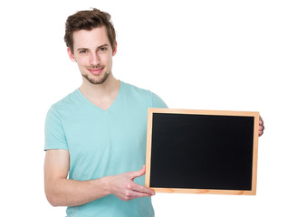 Caucasian man show with blackboard