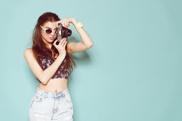 fashion stylish woman dancing and making photo using retro